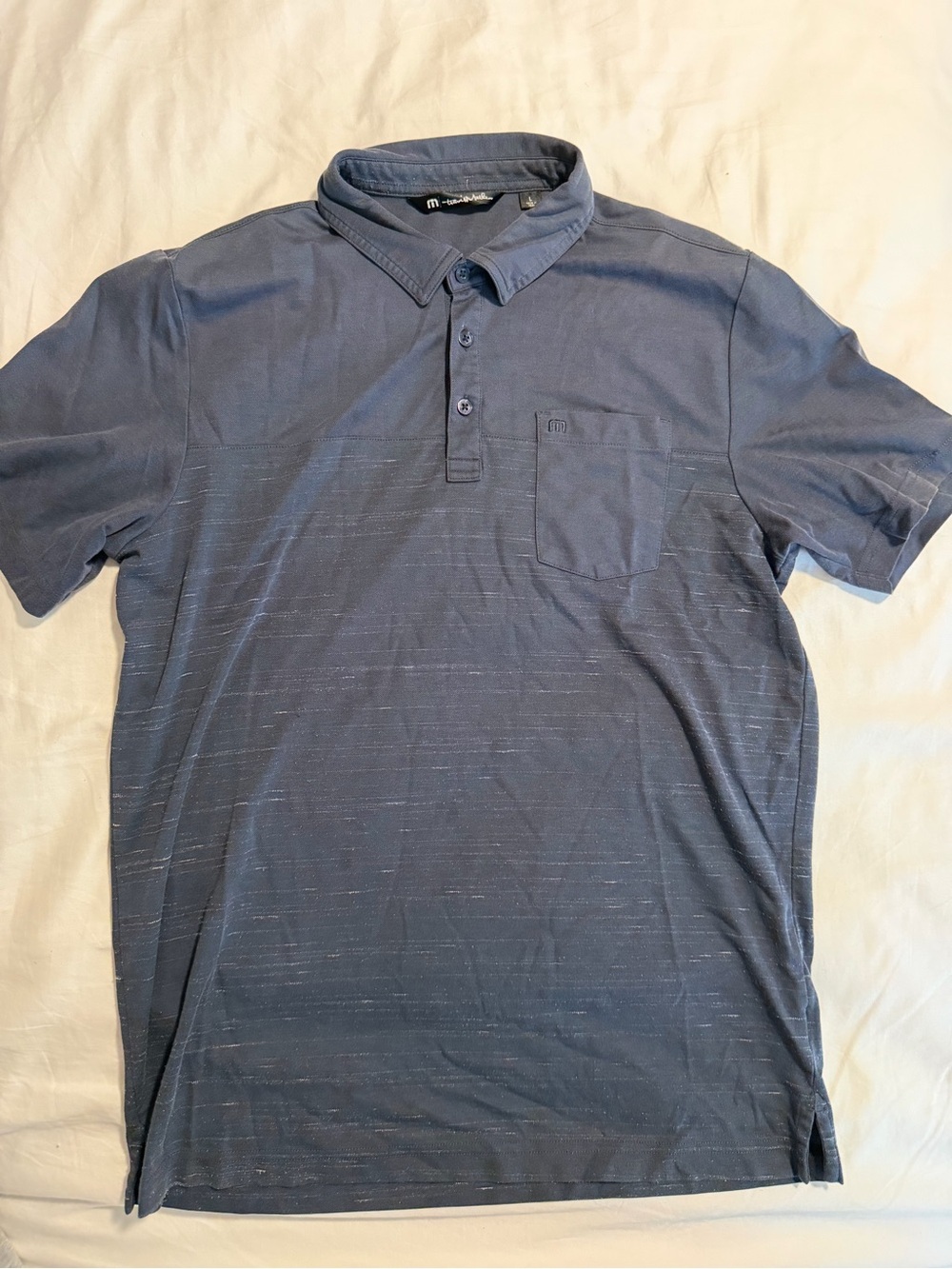 Travis Mathew Blue Golf Polo with Chest Pocket and Colorblock Pattern